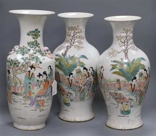 A pair of vases and one other